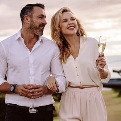 couple smiling and dressed up sleek